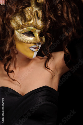 Woman in golden mask