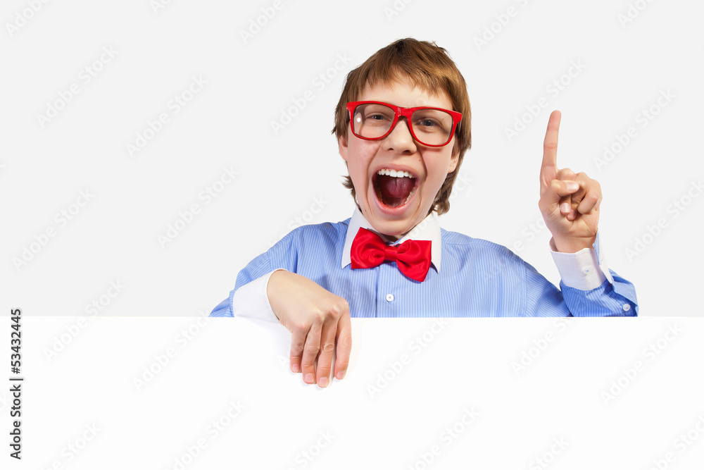 Boy in red glasses holding white square Boy in red glasses holding white square