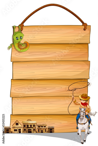A cowboy riding a horse, saloon bars and lizard in front of a wo