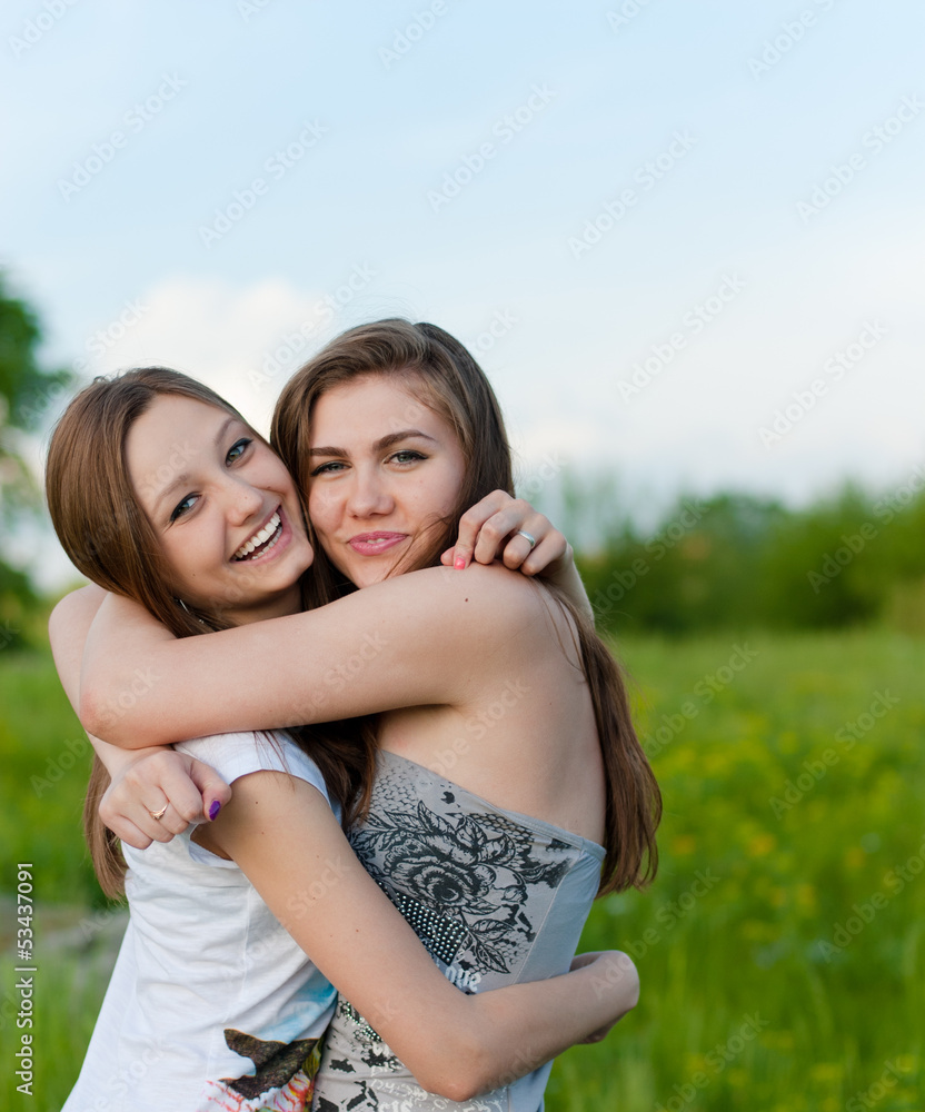 Two Teen Girl Friends embracing Two Teen Girl Friends embracing