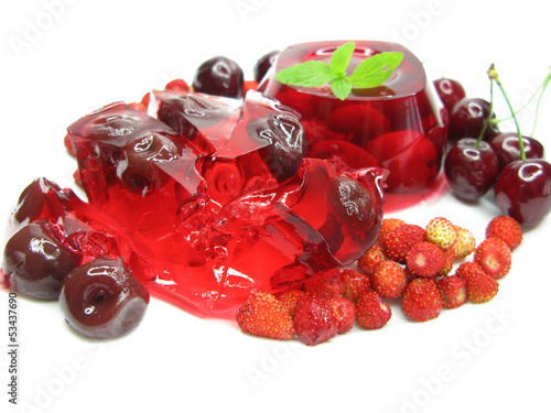 fruit jelly dessert with wild strawberry and cherry