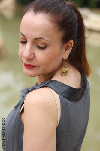 Brunette woman at the park photo