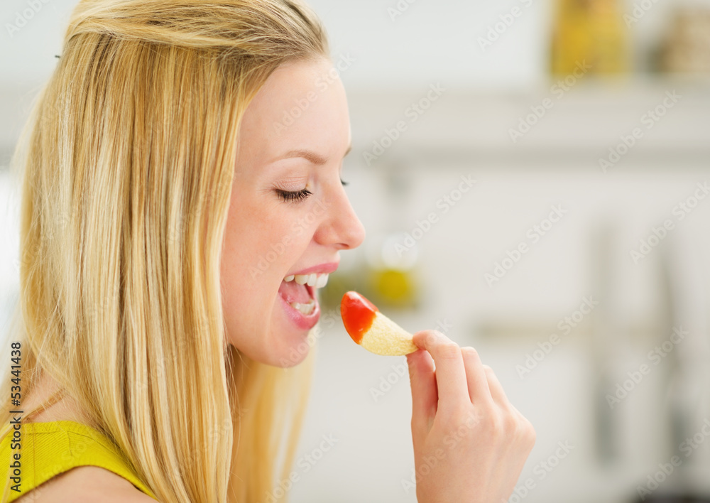 Portrait of smiling teenage girl with chips Portrait of smiling teenage girl with chips