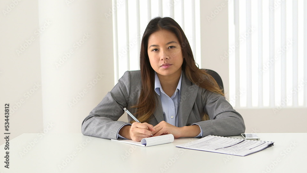 Asian businesswoman talking during video conference Asian businesswoman talking during video conference