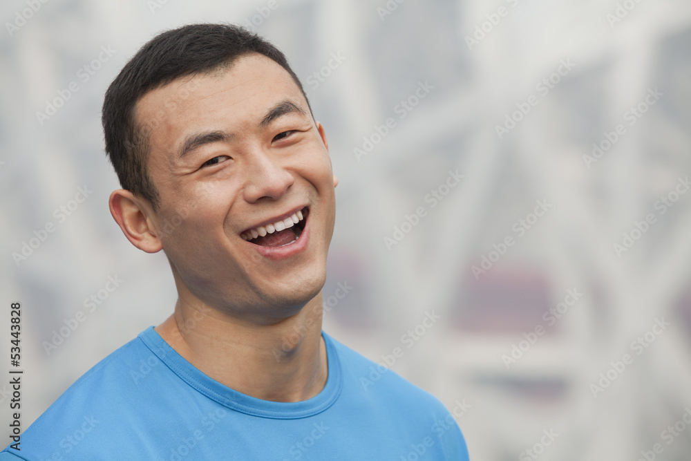 Portrait of young athletic man in Beijing, close-up