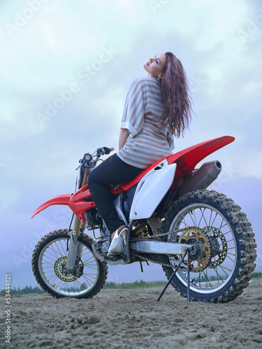 Fototapeta Naklejka Na Ścianę i Meble -  Beautiful girl on a motorcycle.