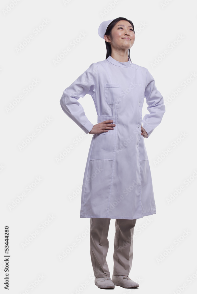 Portrait of Nurse with hands on hips, Studio shot Portrait of Nurse with hands on hips, Studio shot