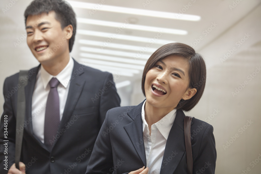 Two Business People Walking Together