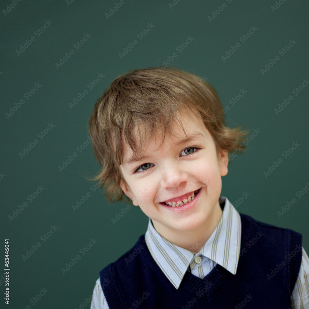 Portrait of student at blackboard background Portrait of student at blackboard background