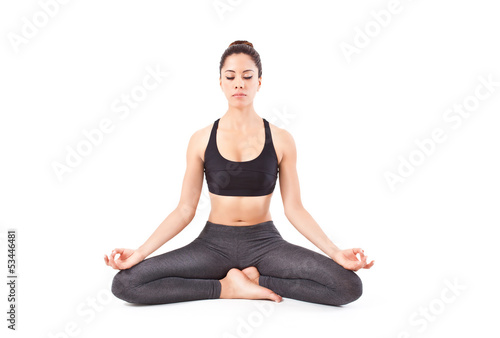 beautiful young woman making a Yoga pose