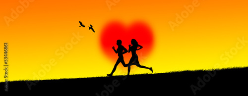 Silhouette of a young loving couple jogging