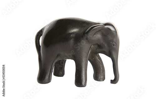 The isolated figurine of an elephant from a tree on a white back