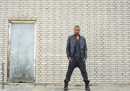 African american fashion model standing in urban environment