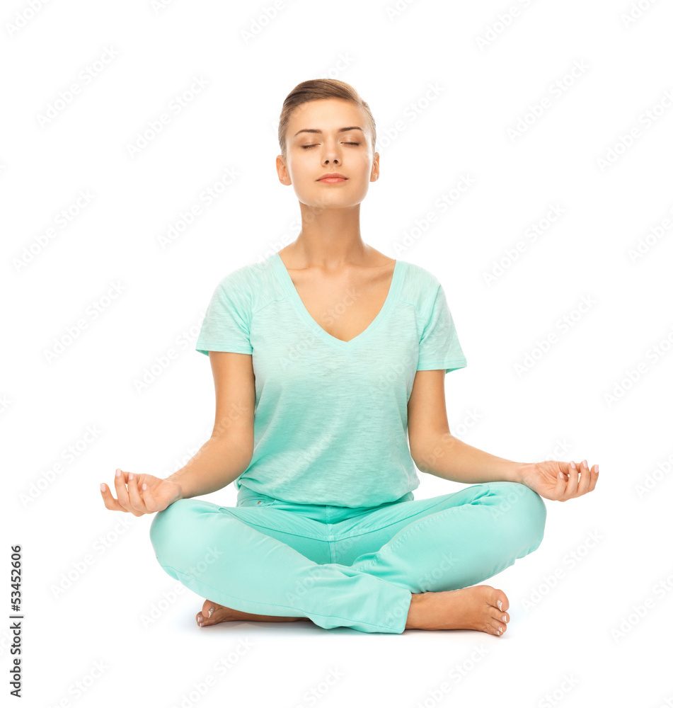girl sitting in lotus position and meditating girl sitting in lotus position and meditating