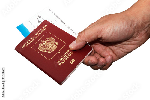 Isoalted Russian passport in hand with boarding pass