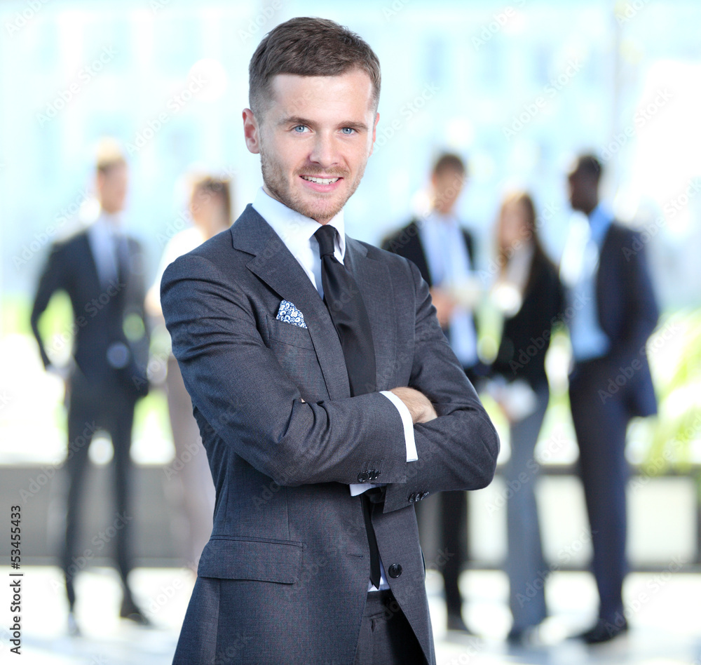 Happy smart business man with team mates discussing Happy smart business man with team mates discussing