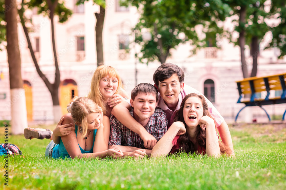 Group of happy smiling Teenage Students Outside Group of happy smiling Teenage Students Outside