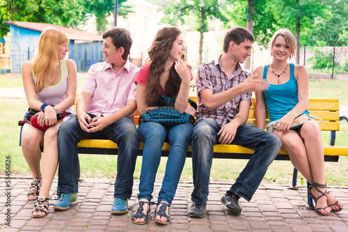 Group of happy smiling Teenage Students Outside