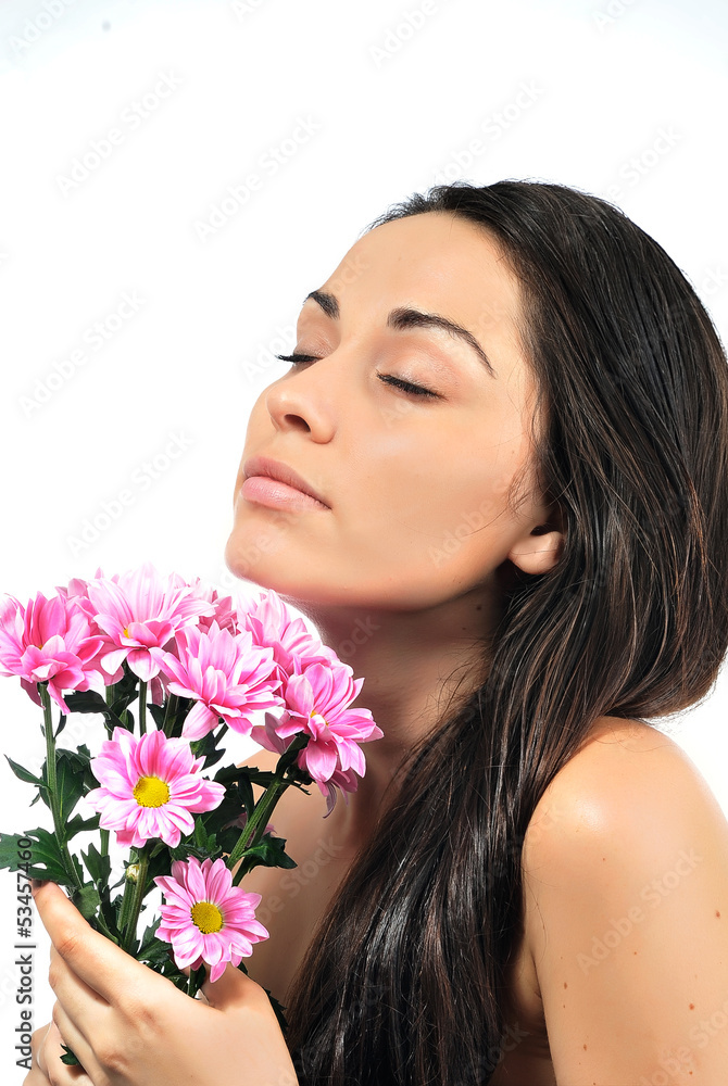 Portrait of young woman with flower