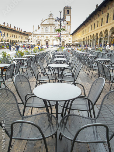 Vigevano Piazza Ducale bar's tables color image