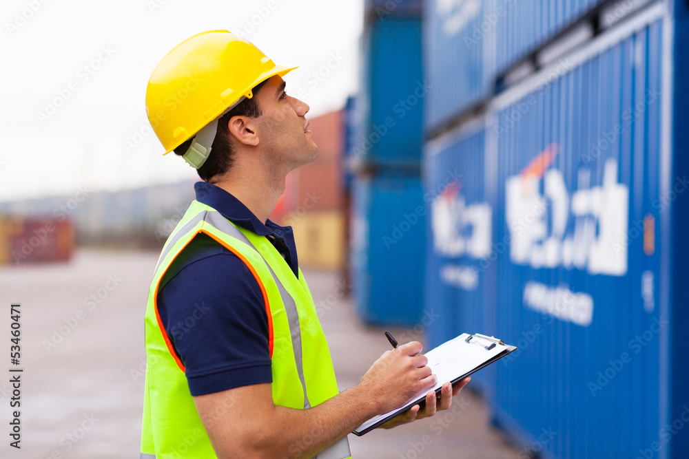 warehouse worker recording containers warehouse worker recording containers