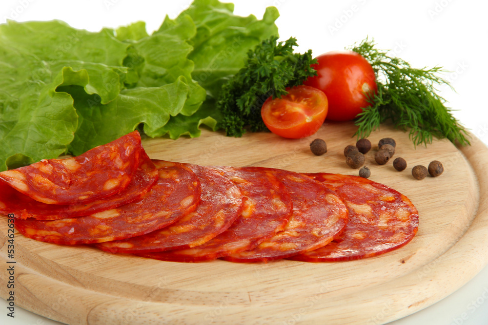 Salami slices on wooden board, close up Salami slices on wooden board, close up