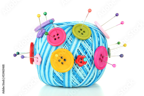 Colorful buttons and wool balls, isolated on white