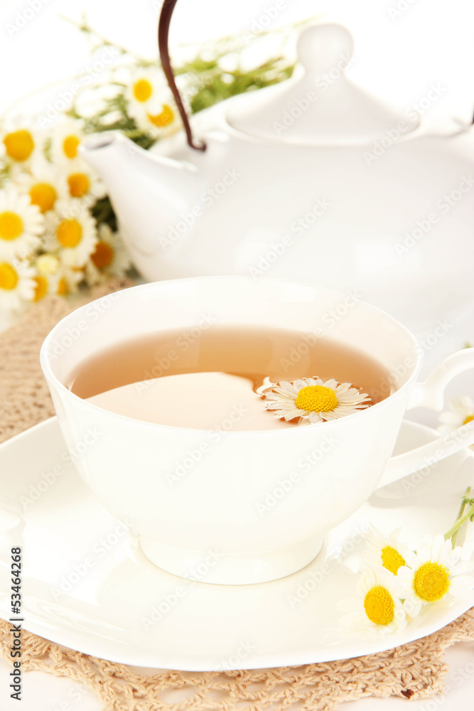 Cup of herbal tea with camomiles close up Cup of herbal tea with camomiles close up