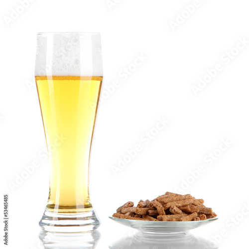 Beer in glass and croutons isolated on white