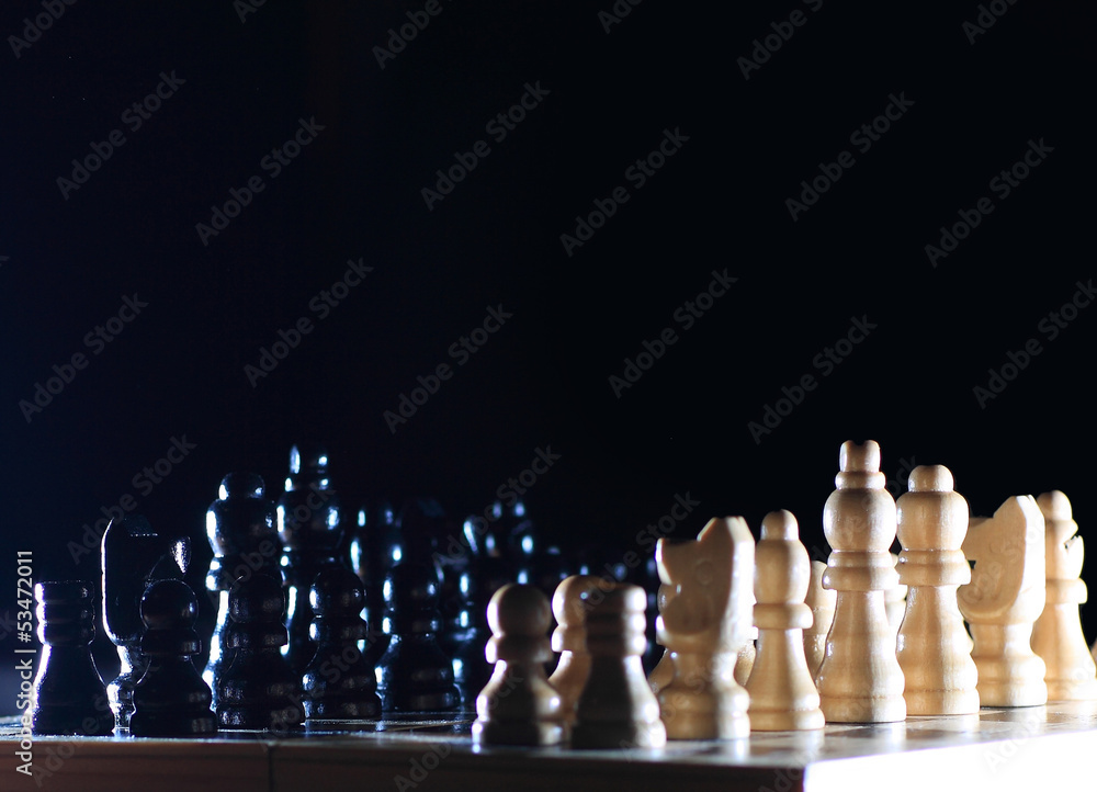 Composition with chessmen on glossy chessboard Composition with chessmen on glossy chessboard