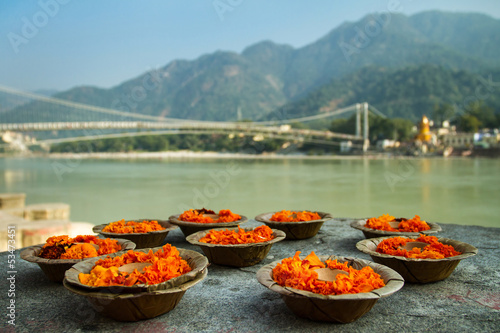 Puja flowers offering at the bank of Ganges river in Rishikesh,