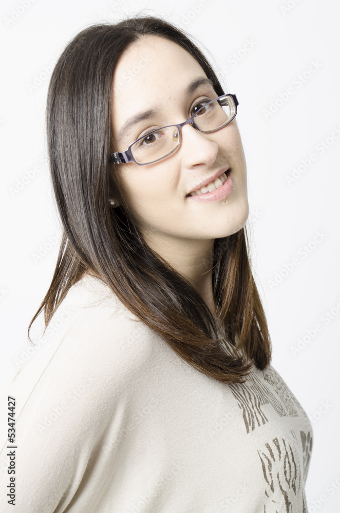 The photo shows a girl with glasses posing The photo shows a girl with glasses posing