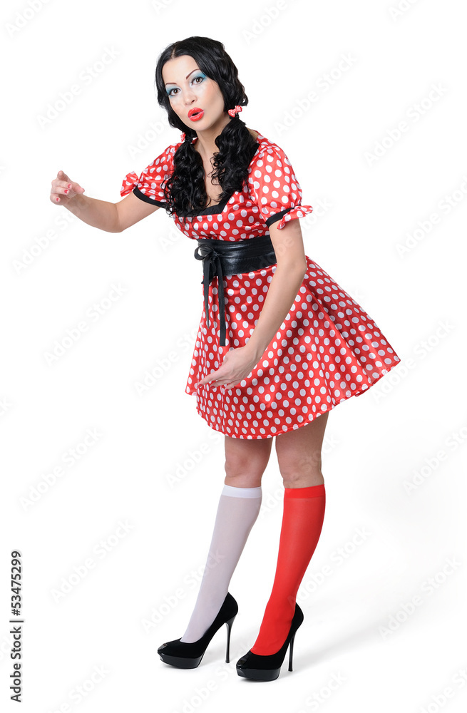 Pinup girl in a red and white polka-dot dress on white Pinup girl in a red and white polka-dot dress on white