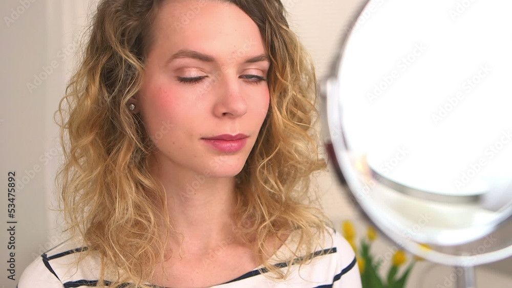 Pretty blonde woman with curly hair