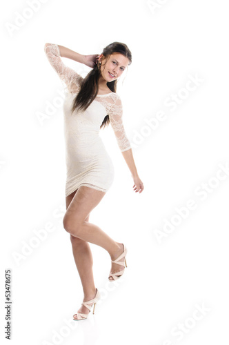 Girl in white dress dancing