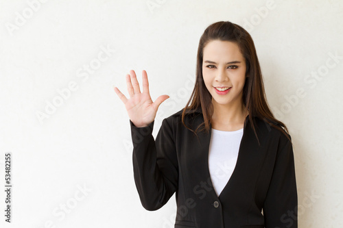 Wallpaper Mural woman business executive showing 5 or five fingers hand gesture Torontodigital.ca