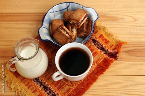 served coffee and milk with biscuits