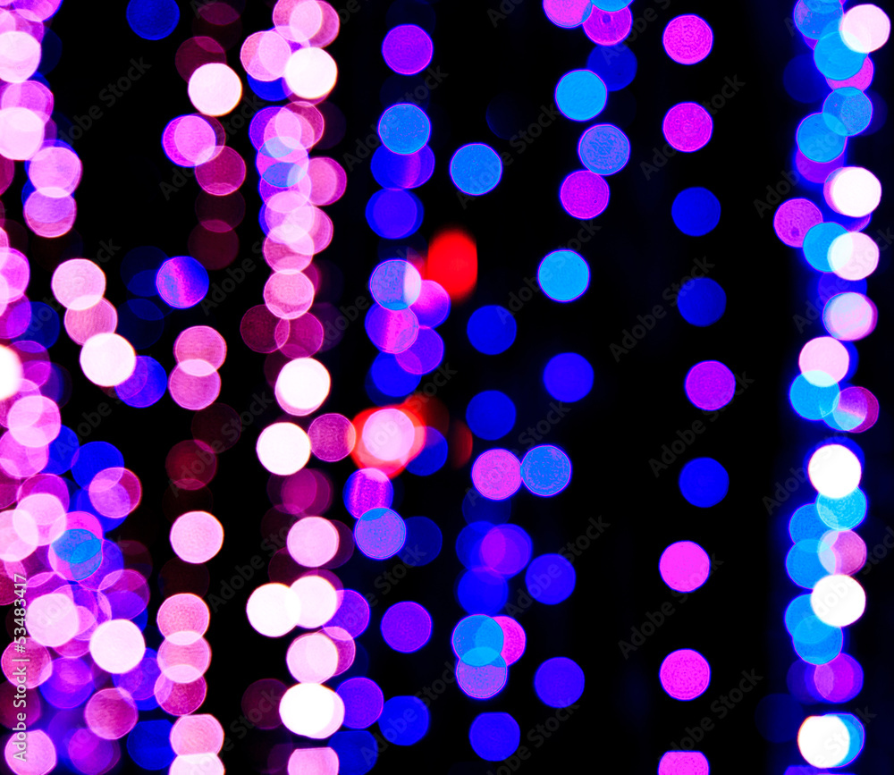 Defocused light bulbs at night as background Defocused light bulbs at night as background