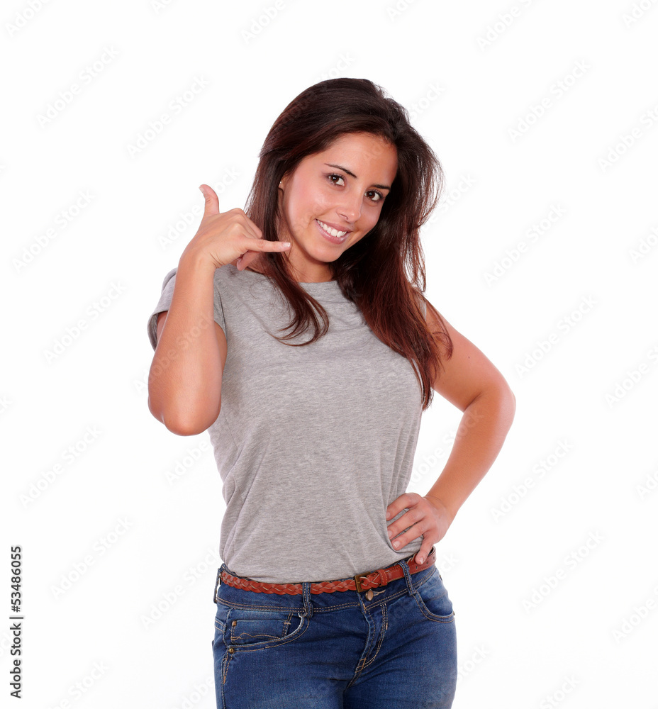 Fototapeta premium Smiling young woman looking at you saying call me