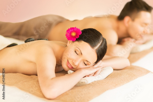 couple in spa with hot stones