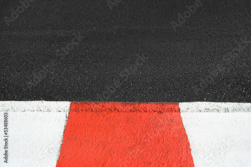 Texture of race asphalt and curb on Grand Prix circuit photo