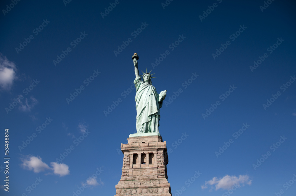 Statue of Liberty panoramic view blue sky background