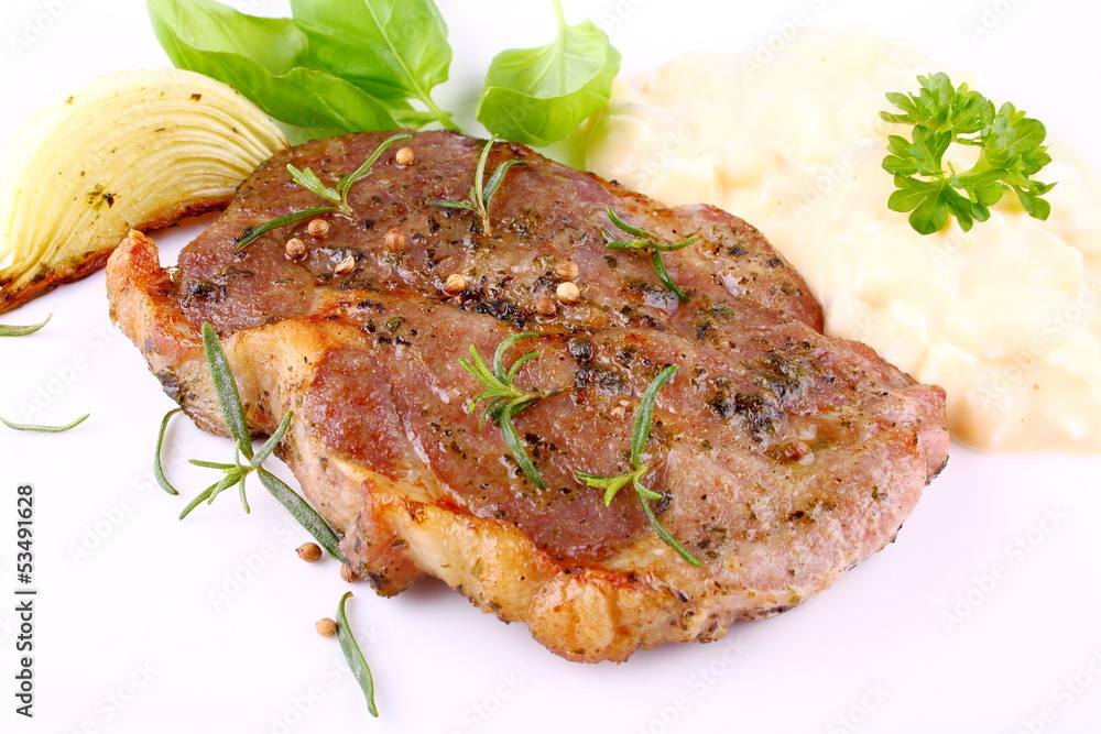 Herb Grilled steak meat with onion, potato salad Herb Grilled steak meat with onion, potato salad