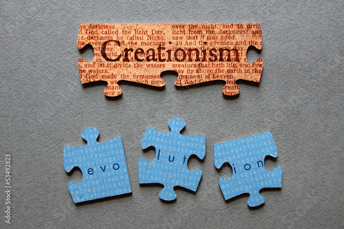 Bild auf Leinwand Creationism Matched and Evolution Mismatched Jigsaw