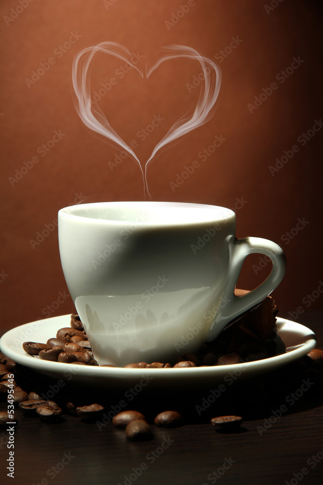 Cup of coffee with smoke in shape of heart on brown background Cup of coffee with smoke in shape of heart on brown background