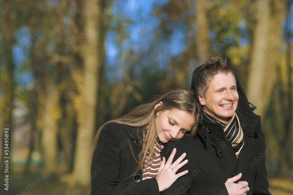 yuong caucasian couple walking in the park yuong caucasian couple walking in the park