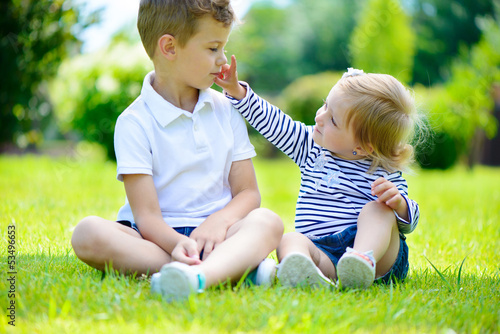Canvas Print Happy sister and brother together in park