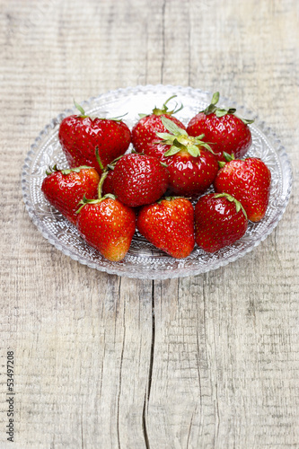Strawberries on wooden table. Copy space.