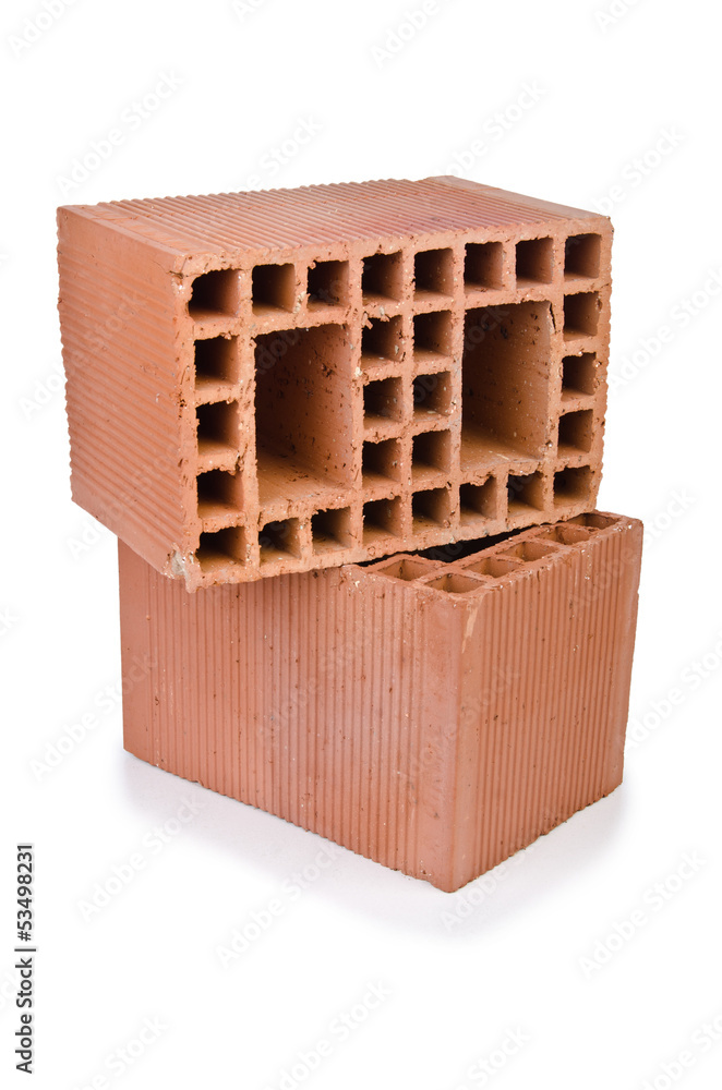 Stack of clay bricks isolated on white