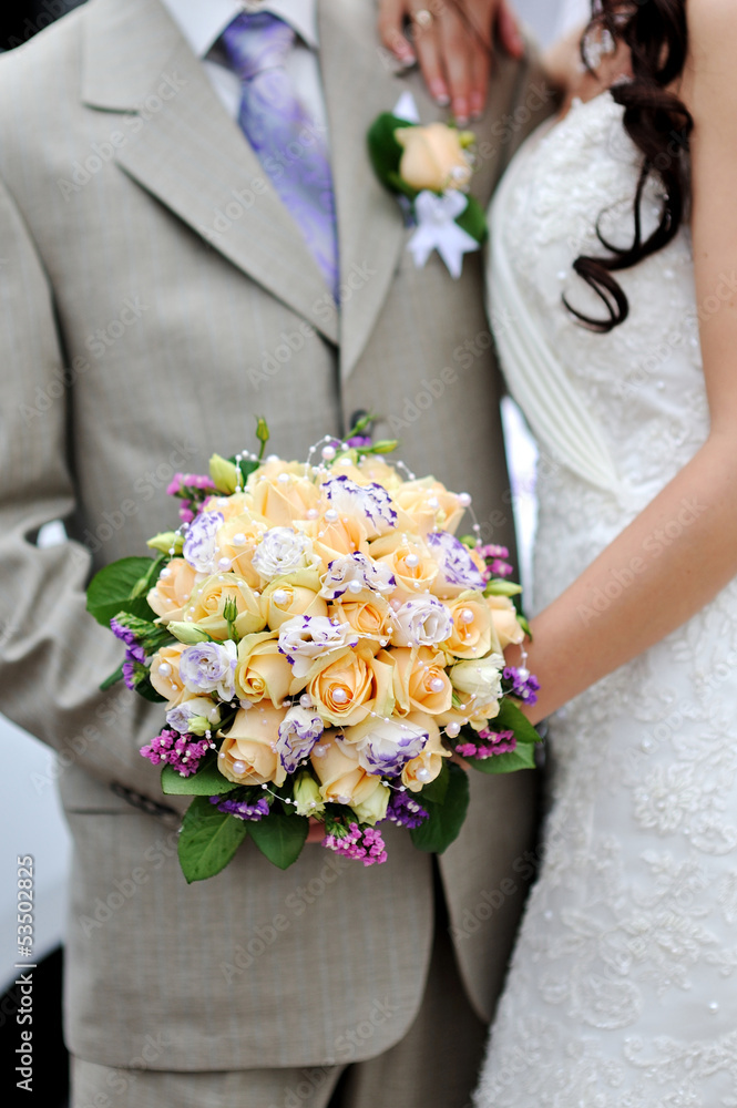 wedding bouquet at bride's hands wedding bouquet at bride's hands